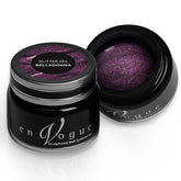 en Vogue belladonna purple, magenta, and gold microglitter gel polish for professional nails and extensions shown in container