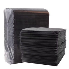Plastic backed disposable table towels