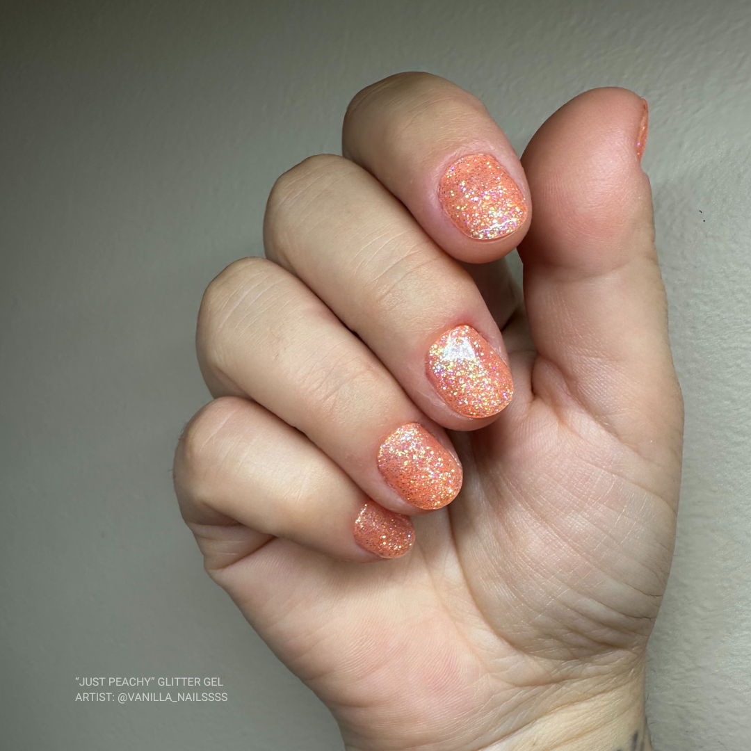 en Vogue just peachy bright peach jelly base with iridescent micro-glitter gel polish for professional nails and extensions shown on oval nails manicure