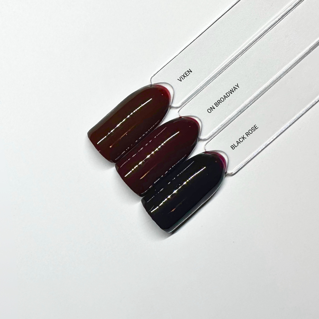 en Vogue Lac it! Black Rose, black cherry burgundy crème UV/LED gel polish for professional nails and extensions shown on nail swatch sticks with Vixen and On Broadway