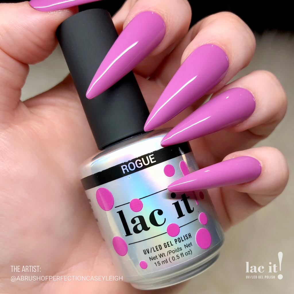 en Vogue Lac It! Rogue pink/purple orchid crème UV/LED gel nail polish for professional nails and extensions on long stiletto nails holding polish bottle